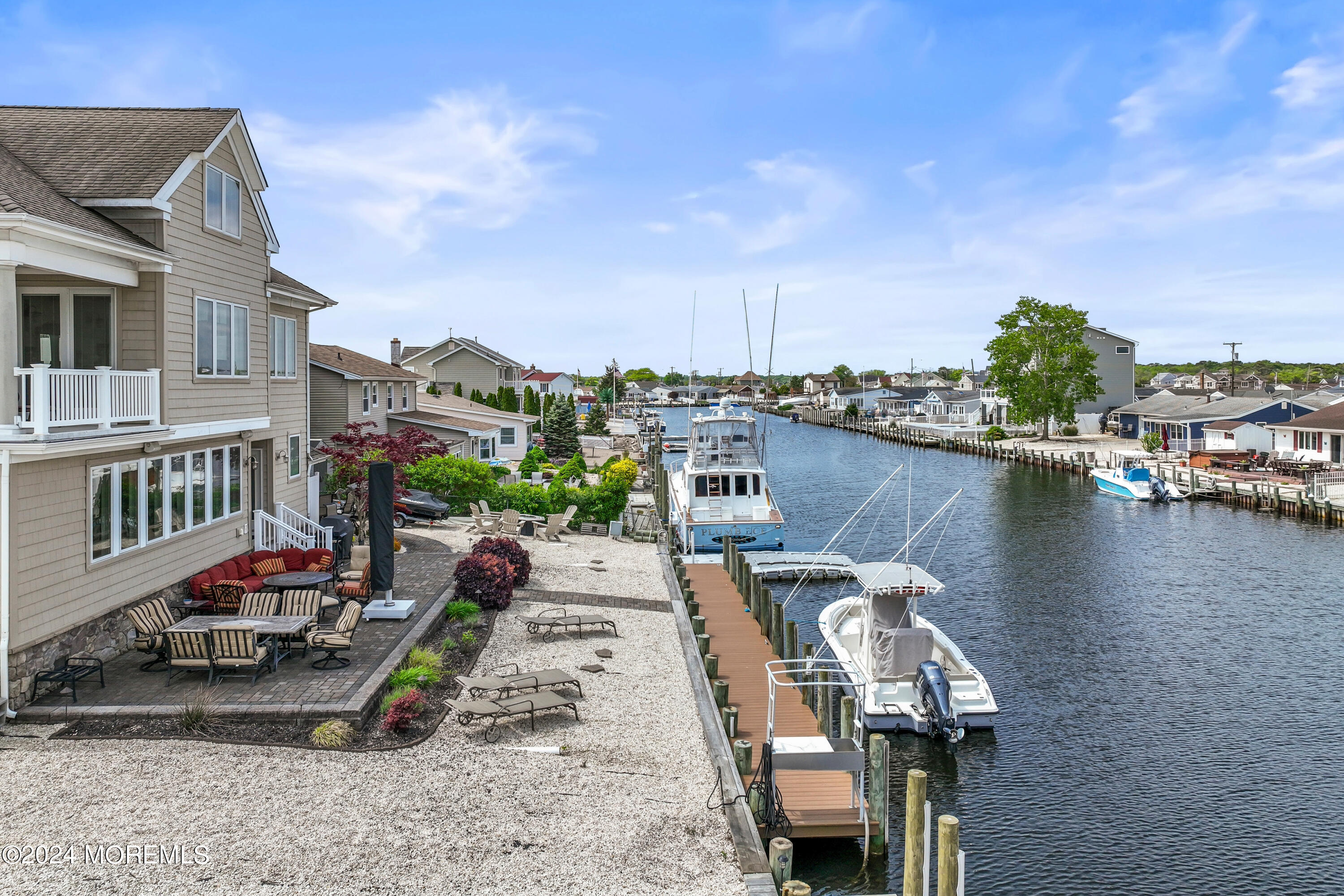 113 Stillwater Road Barnegat, NJ 08005 - Photo 60 of 61 a view of a lake with a terrace