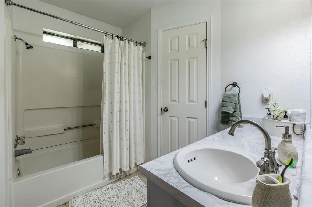 1815 Riata Drive Woodway, TX 76712 - Photo 11 of 25 a bathroom with a sink and mirror
