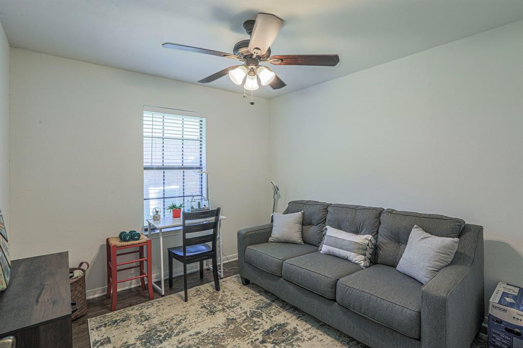 1815 Riata Drive Woodway, TX 76712 - Photo 13 of 25 a living room with furniture and a window