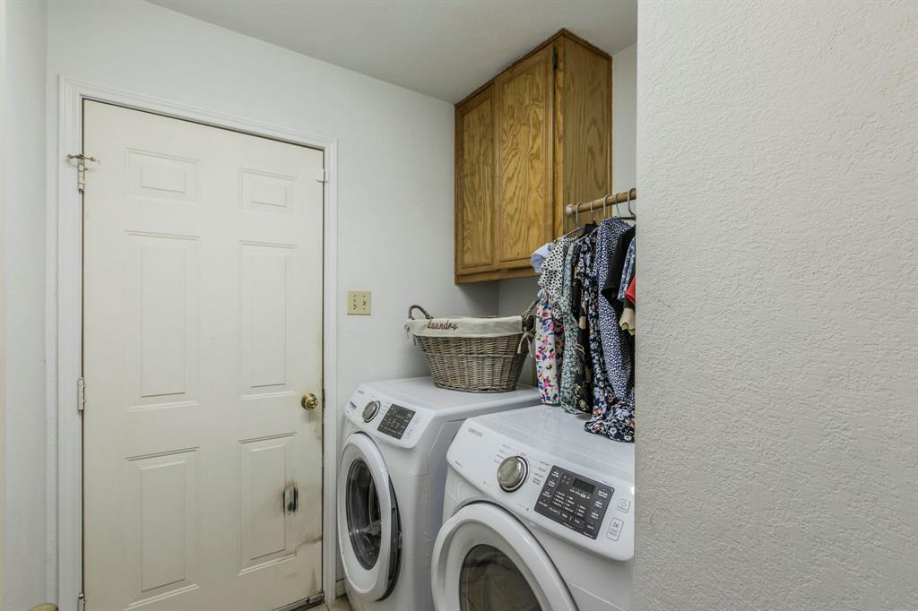 1815 Riata Drive Woodway, TX 76712 - Photo 20 of 25 a view of storage and utility room with washer and dryer