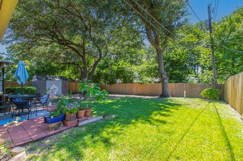 1815 Riata Drive Woodway, TX 76712 - Photo 24 of 25 a view of backyard with swimming pool and garden