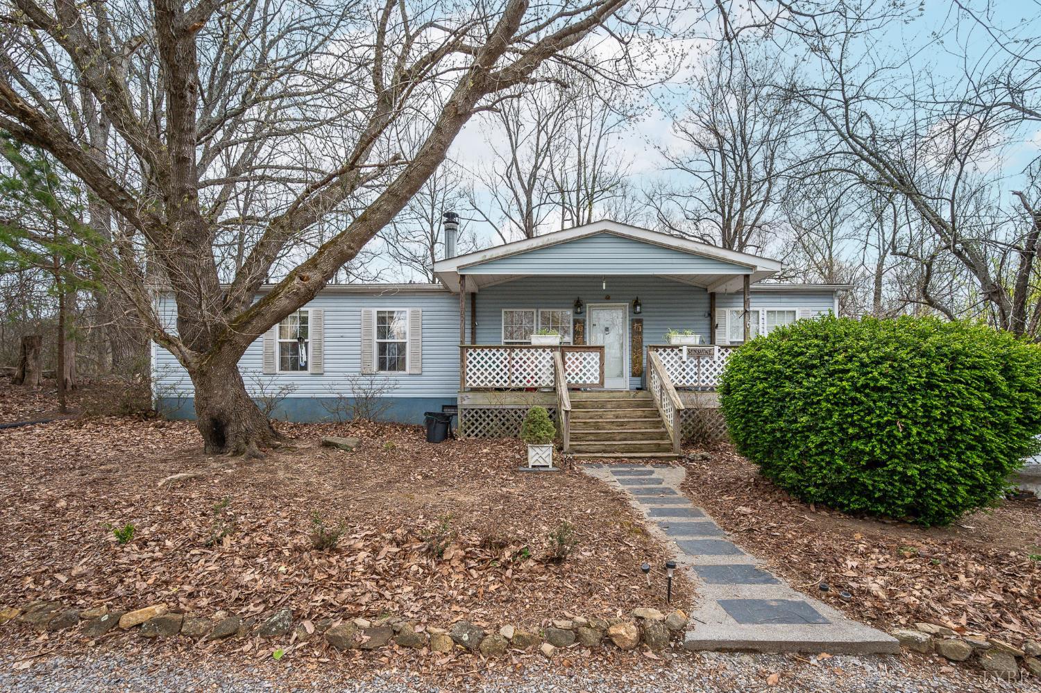 4400 Murray Hollow Road Thaxton, VA 24174 - Photo 2 of 56 a front view of a house with garden