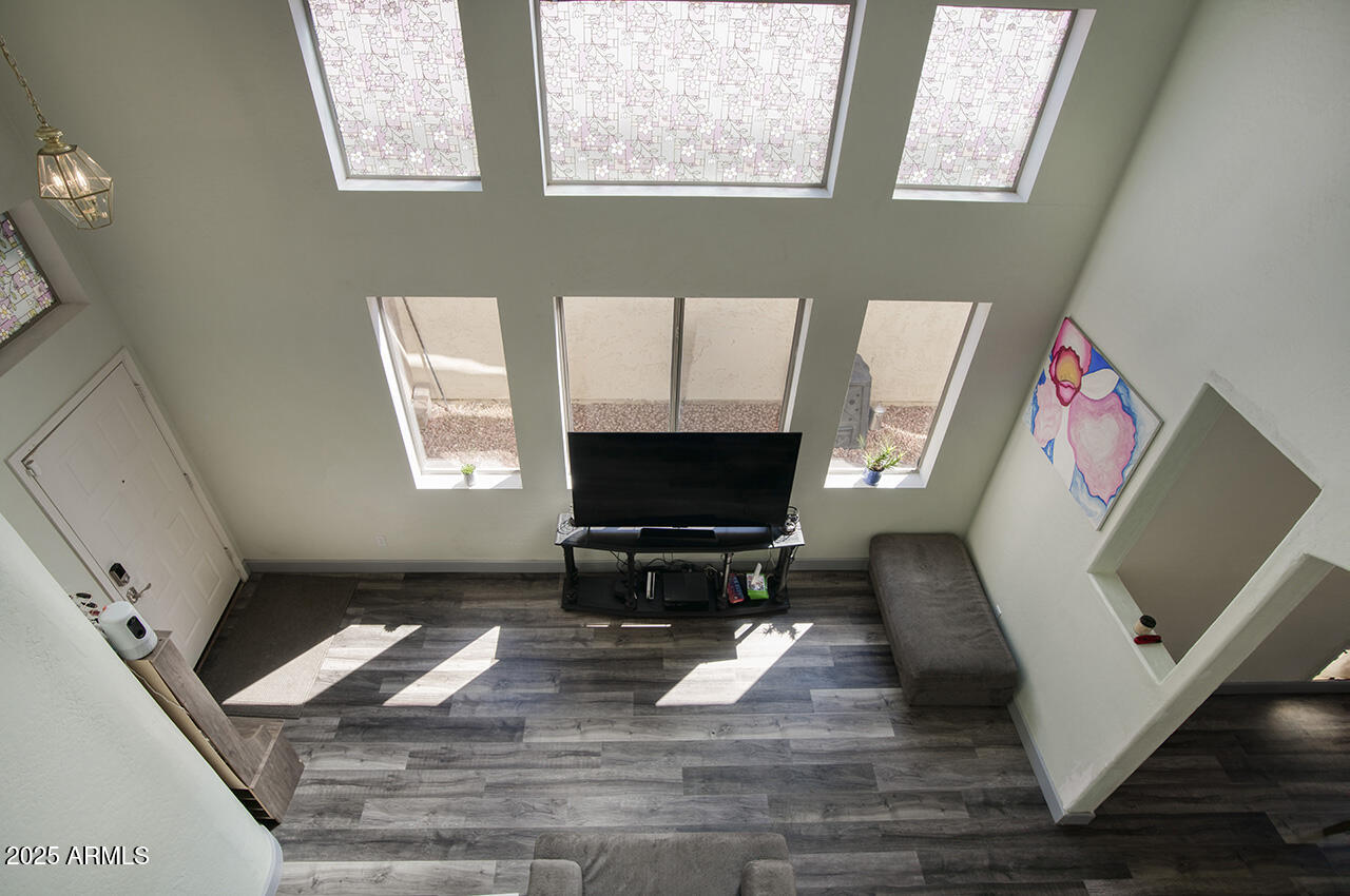 10617 West Coronado Road Avondale, AZ 85392 - Photo 13 of 32 a living room with furniture and a fireplace