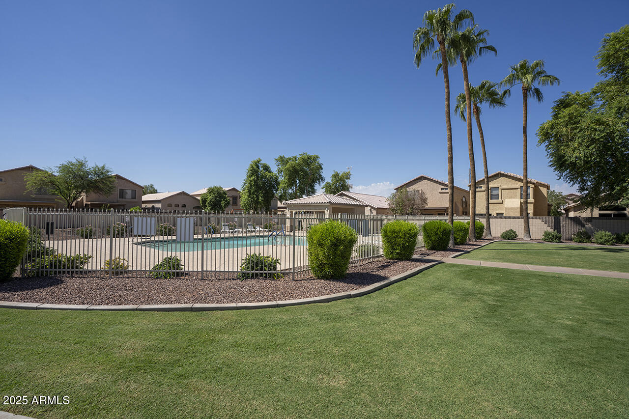 10617 West Coronado Road Avondale, AZ 85392 - Photo 24 of 32 a front view of a house with garden