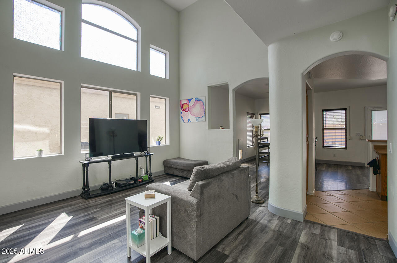 10617 West Coronado Road Avondale, AZ 85392 - Photo 4 of 32 a living room with furniture and a flat screen tv