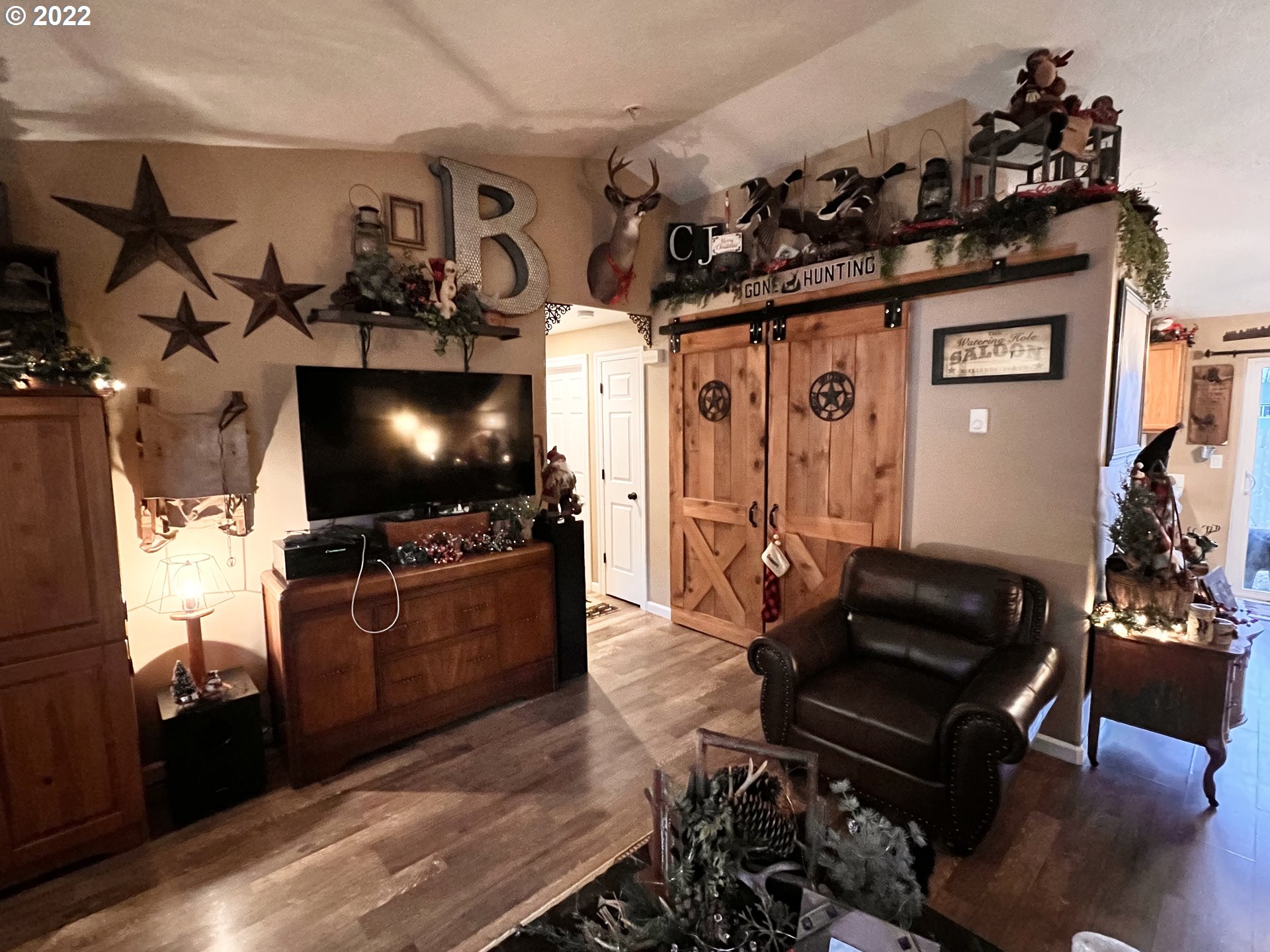 1654 South 59th Street Springfield, OR 97478 - Photo 4 of 15 a living room with furniture and a flat screen tv