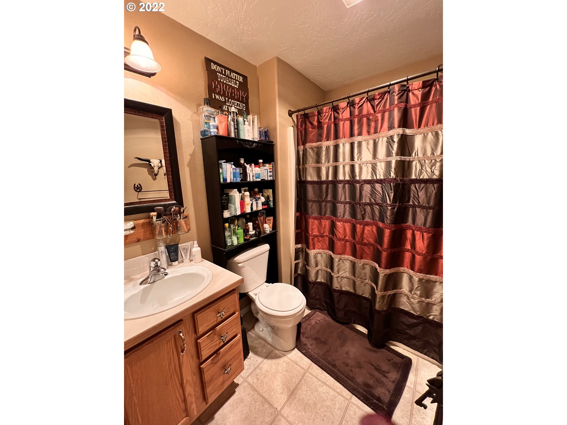 1654 South 59th Street Springfield, OR 97478 - Photo 10 of 15 a bathroom with a sink toilet and shower