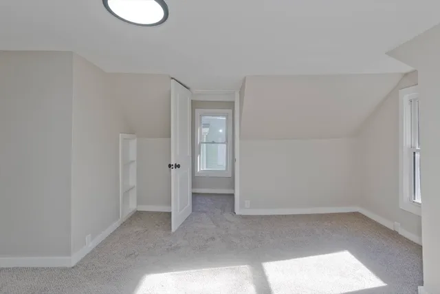 a bathroom with a toilet and shower