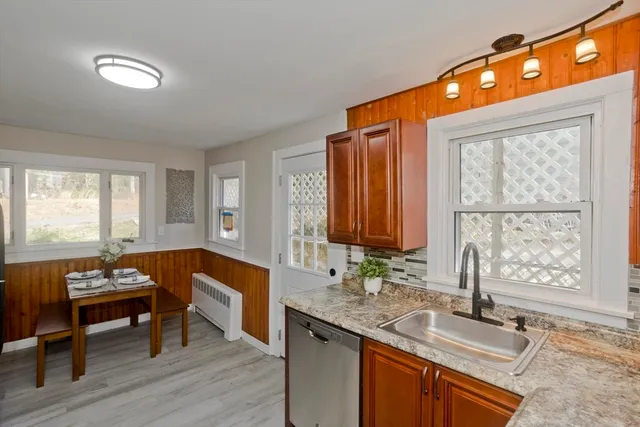 a kitchen with a sink and a window