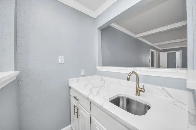 a close view of a sink and a mirror in a bathroom