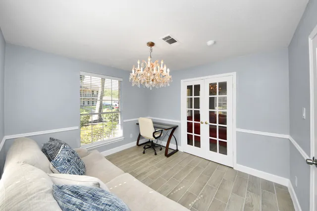 a living room with furniture and a window