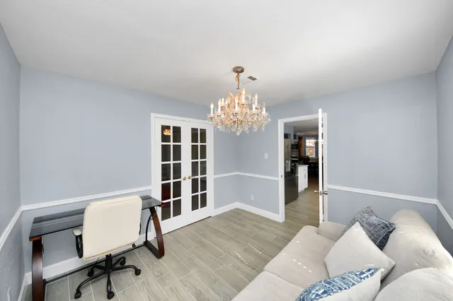 a view of a livingroom with furniture and a window