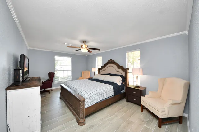 a bed room with a bed and a chair