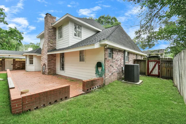 a view of yard with swimming pool and green space