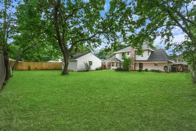 a view of backyard with green space