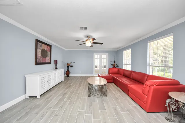a living room with furniture and a large window