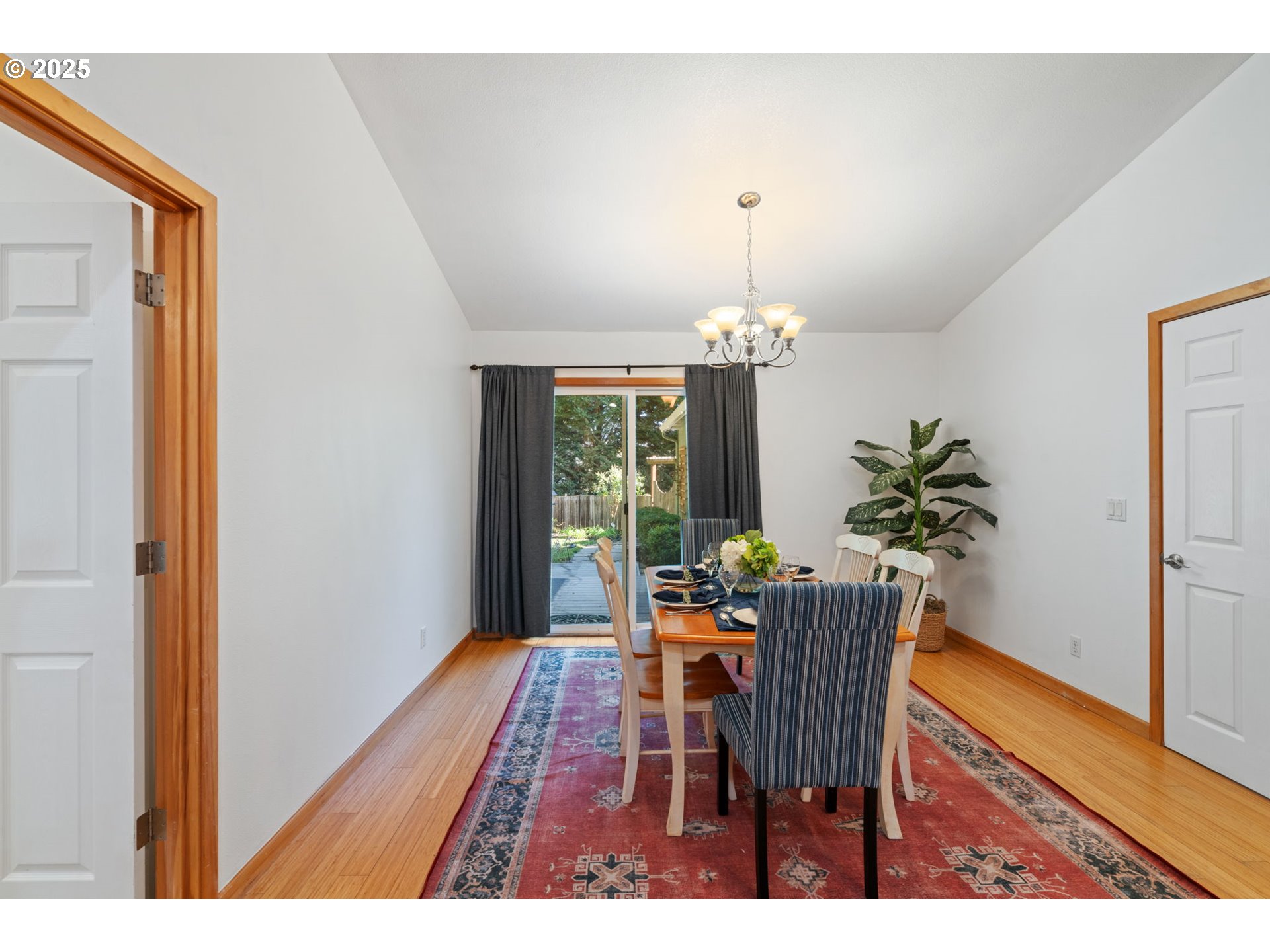 15014 Northeast Caples Road Brush Prairie, WA 98606 - Photo 11 of 39 a dining room with furniture potted plants and wooden floor