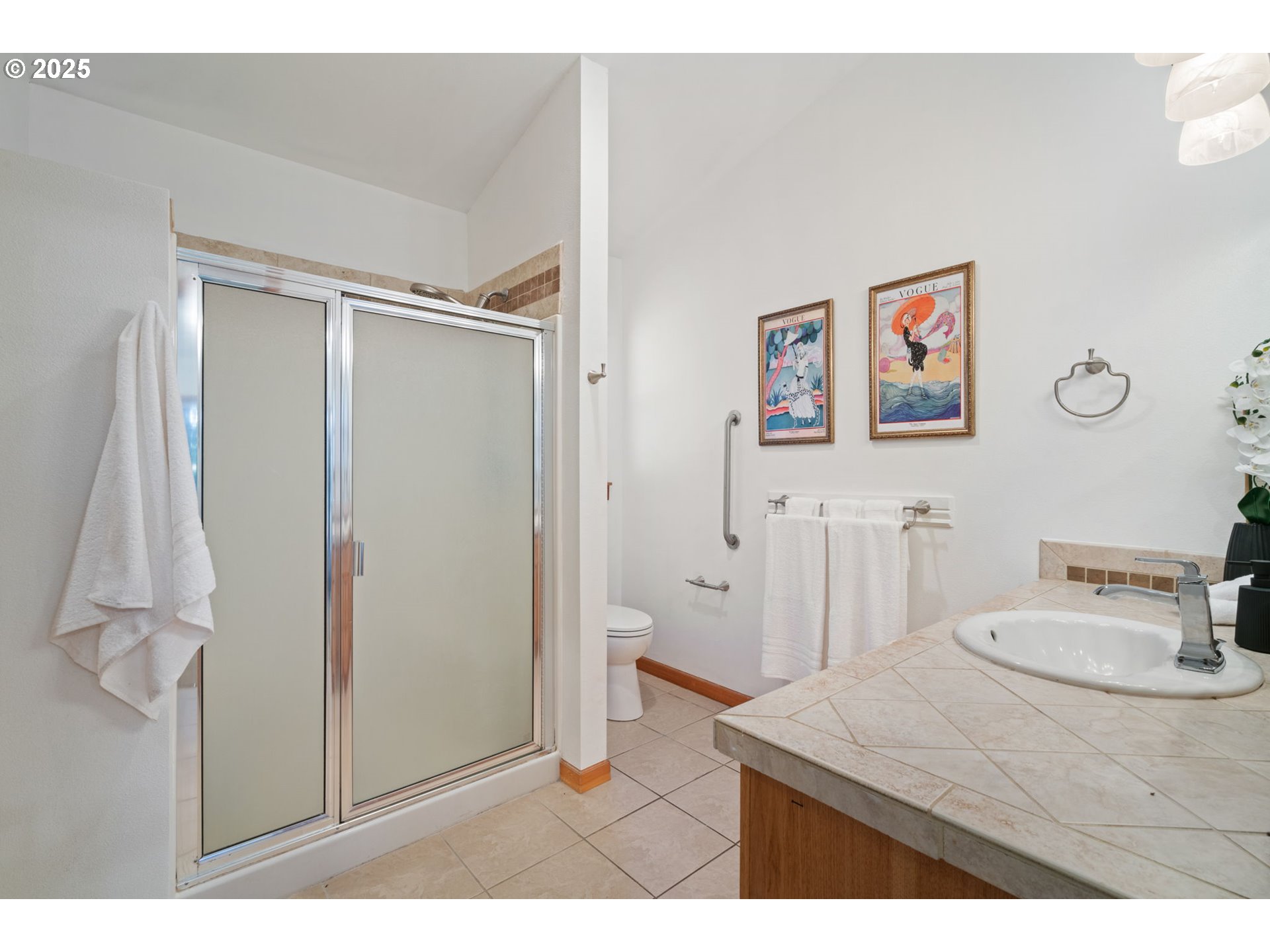 15014 Northeast Caples Road Brush Prairie, WA 98606 - Photo 18 of 39 a bathroom with a sink vanity and a mirror