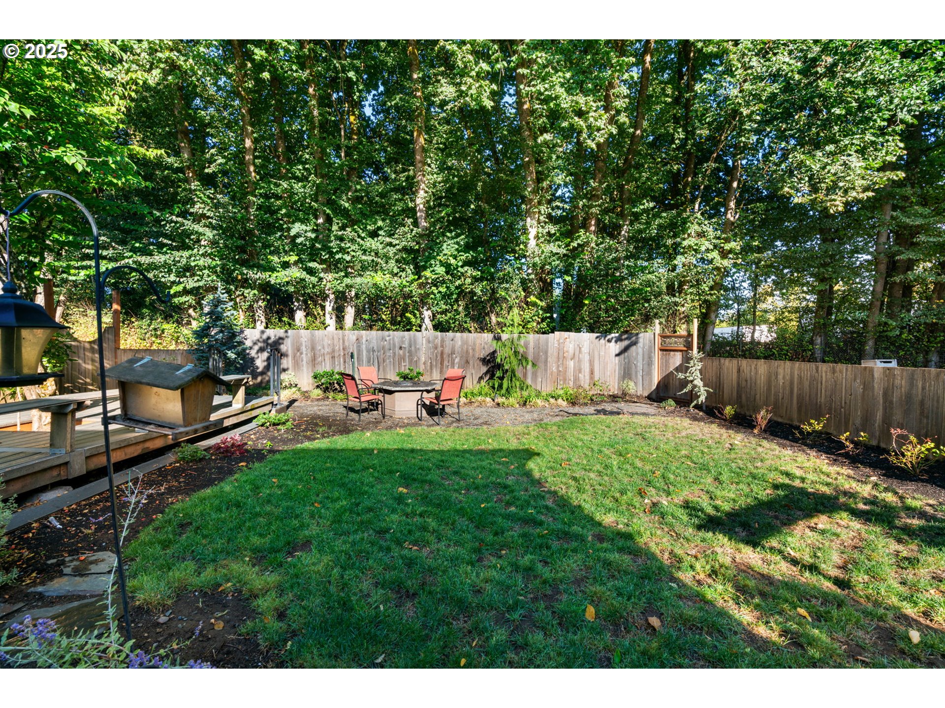 15014 Northeast Caples Road Brush Prairie, WA 98606 - Photo 37 of 39 a backyard of a house with table and chairs
