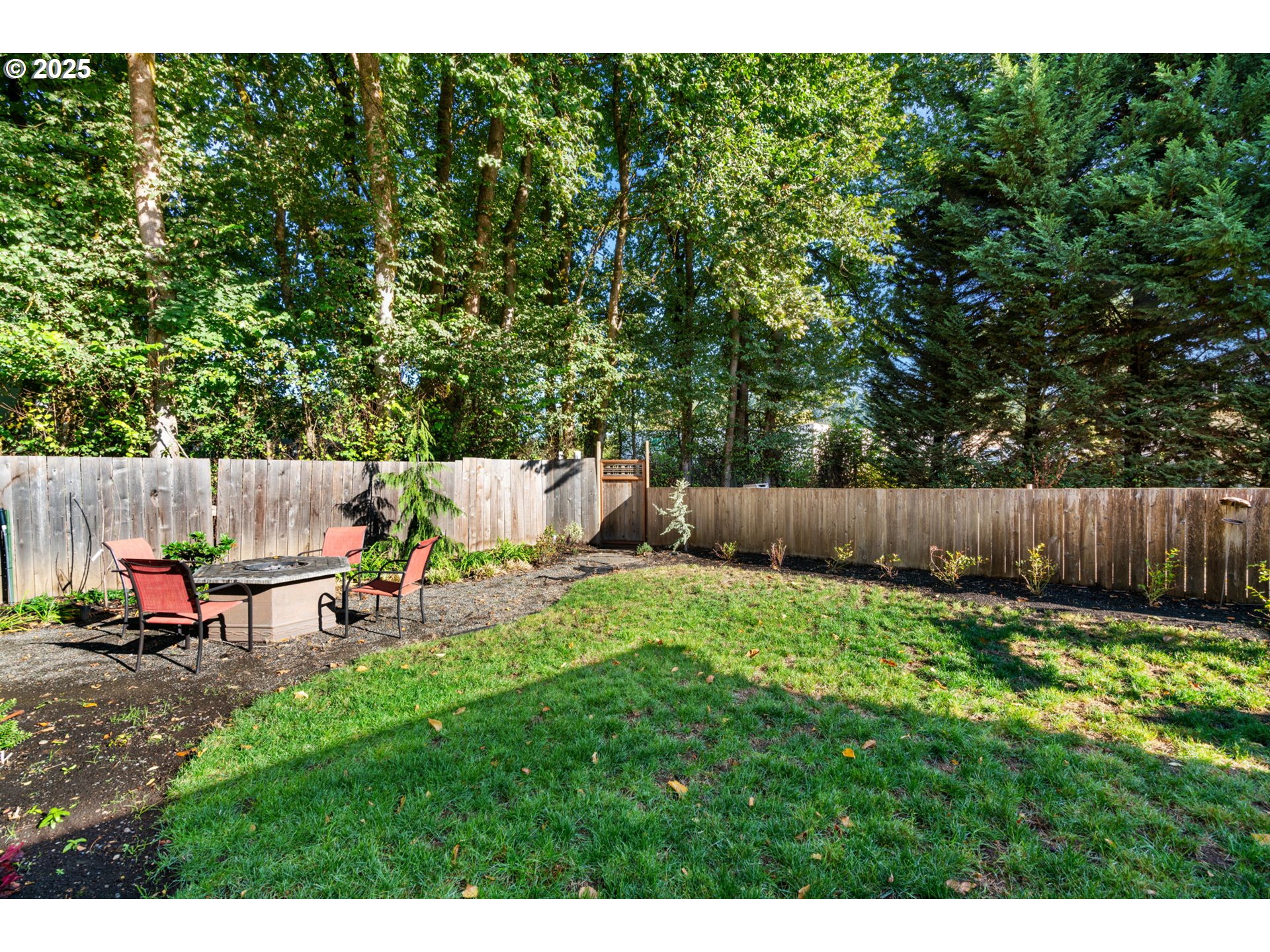 15014 Northeast Caples Road Brush Prairie, WA 98606 - Photo 38 of 39 a view of a backyard with chairs and a slide
