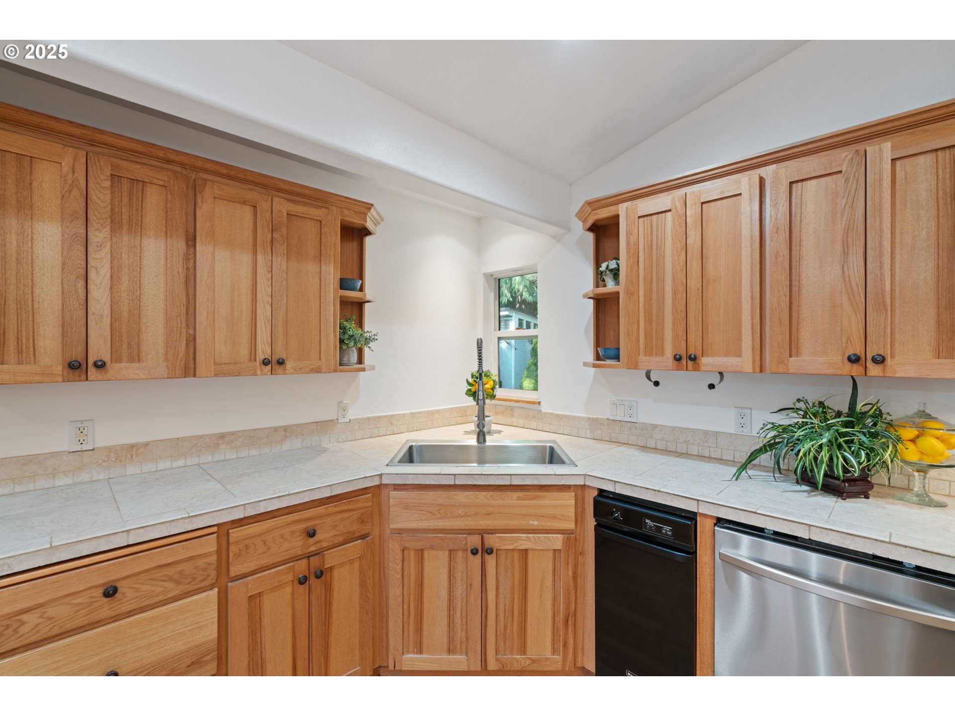 15014 Northeast Caples Road Brush Prairie, WA 98606 - Photo 6 of 39 a kitchen with stainless steel appliances granite countertop a sink a refrigerator and cabinets