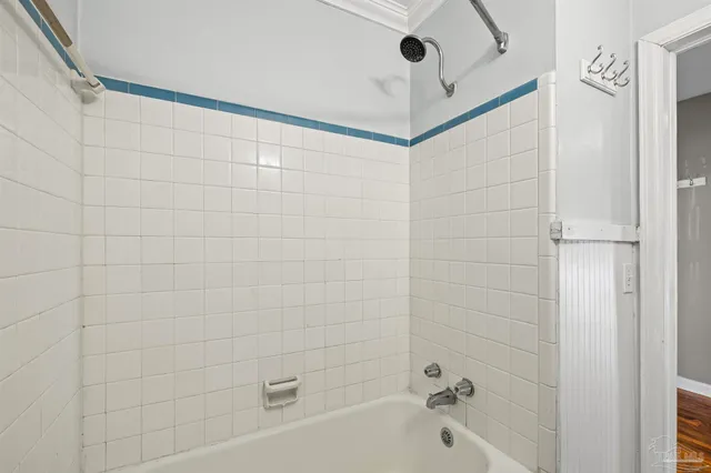 a bathroom with a shower and a bathtub
