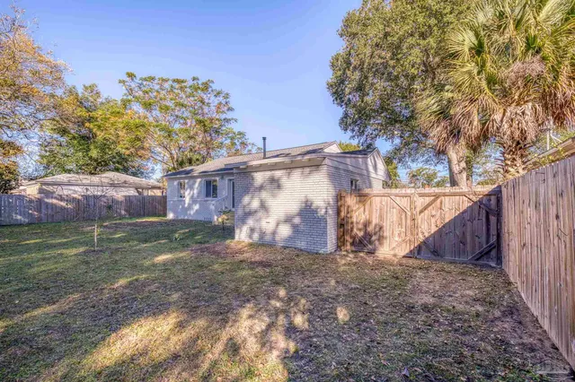 a view of a house with a back yard
