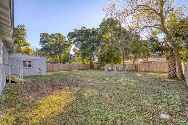 a view of a yard with a tree