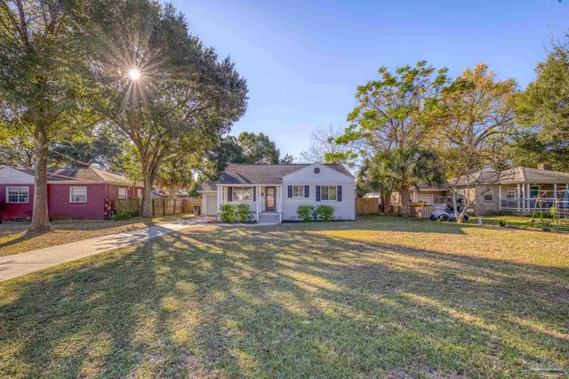 a view of a house with a yard