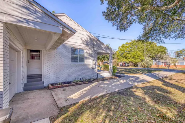 a view of a backyard of the house