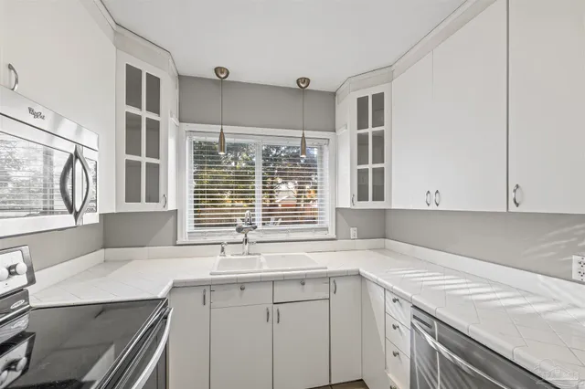 a kitchen with a sink and a window