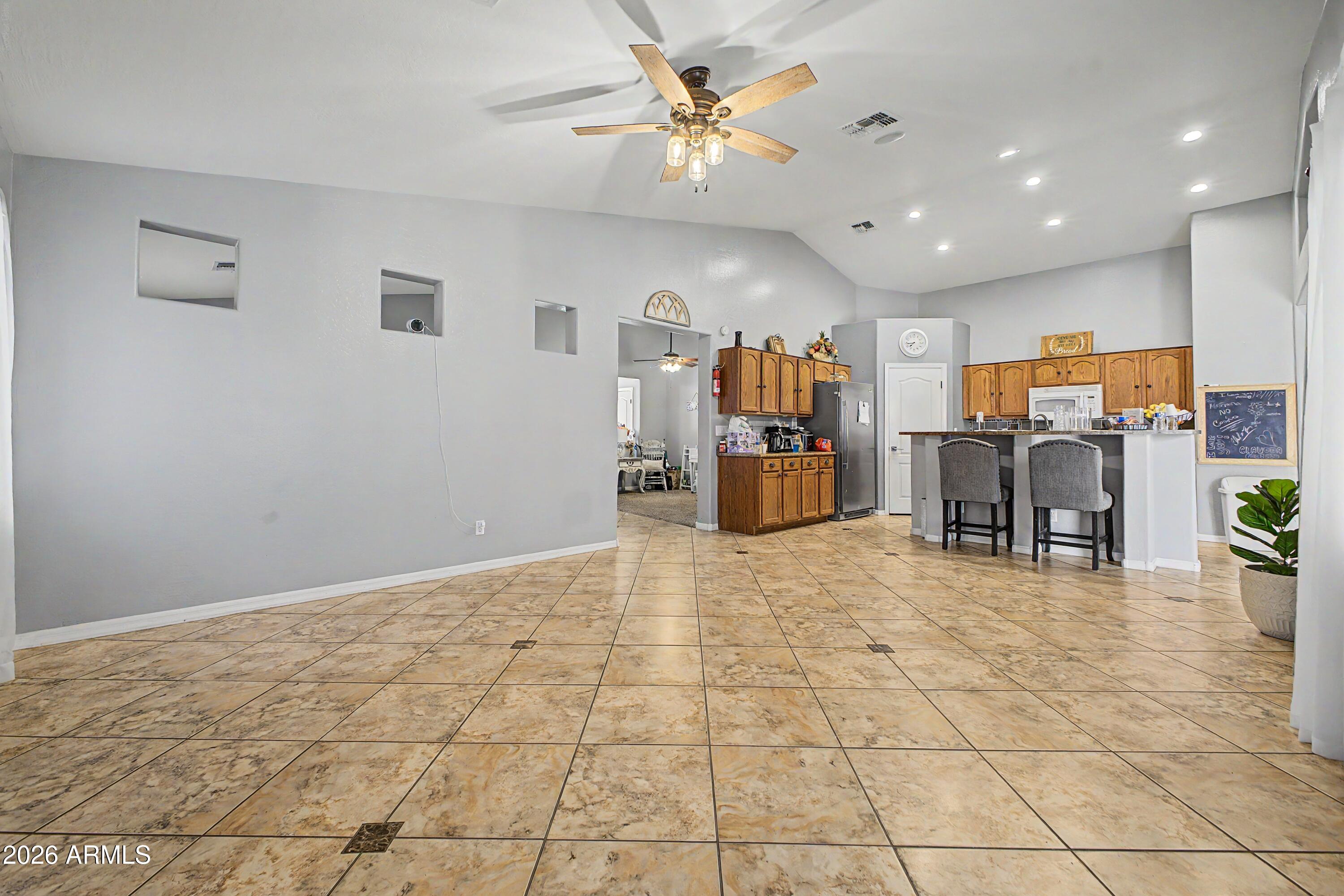 25652 West Rio Vista Lane Buckeye, AZ 85326 - Photo 11 of 32 a view of a livingroom with furniture and a window