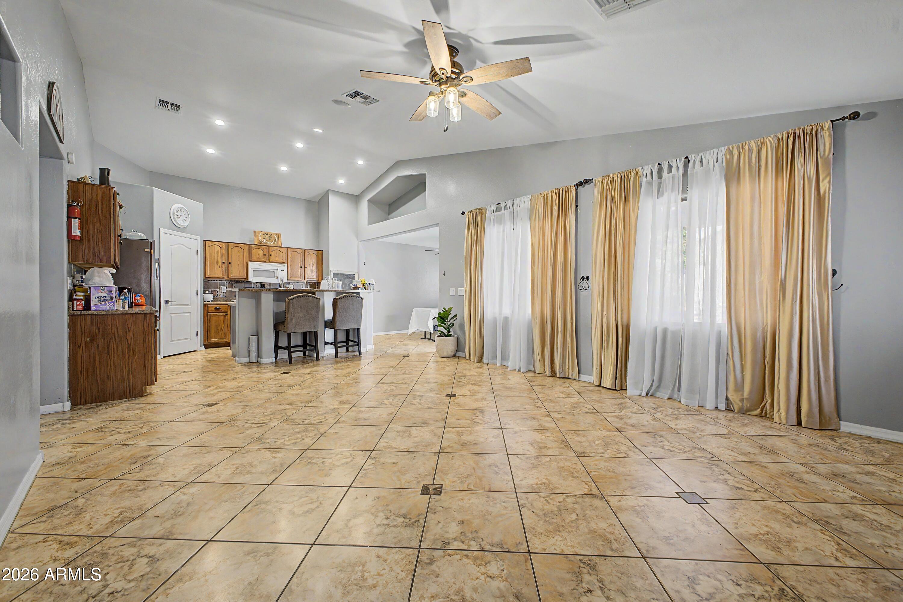 25652 West Rio Vista Lane Buckeye, AZ 85326 - Photo 10 of 32 a view of livingroom with kitchen and furniture