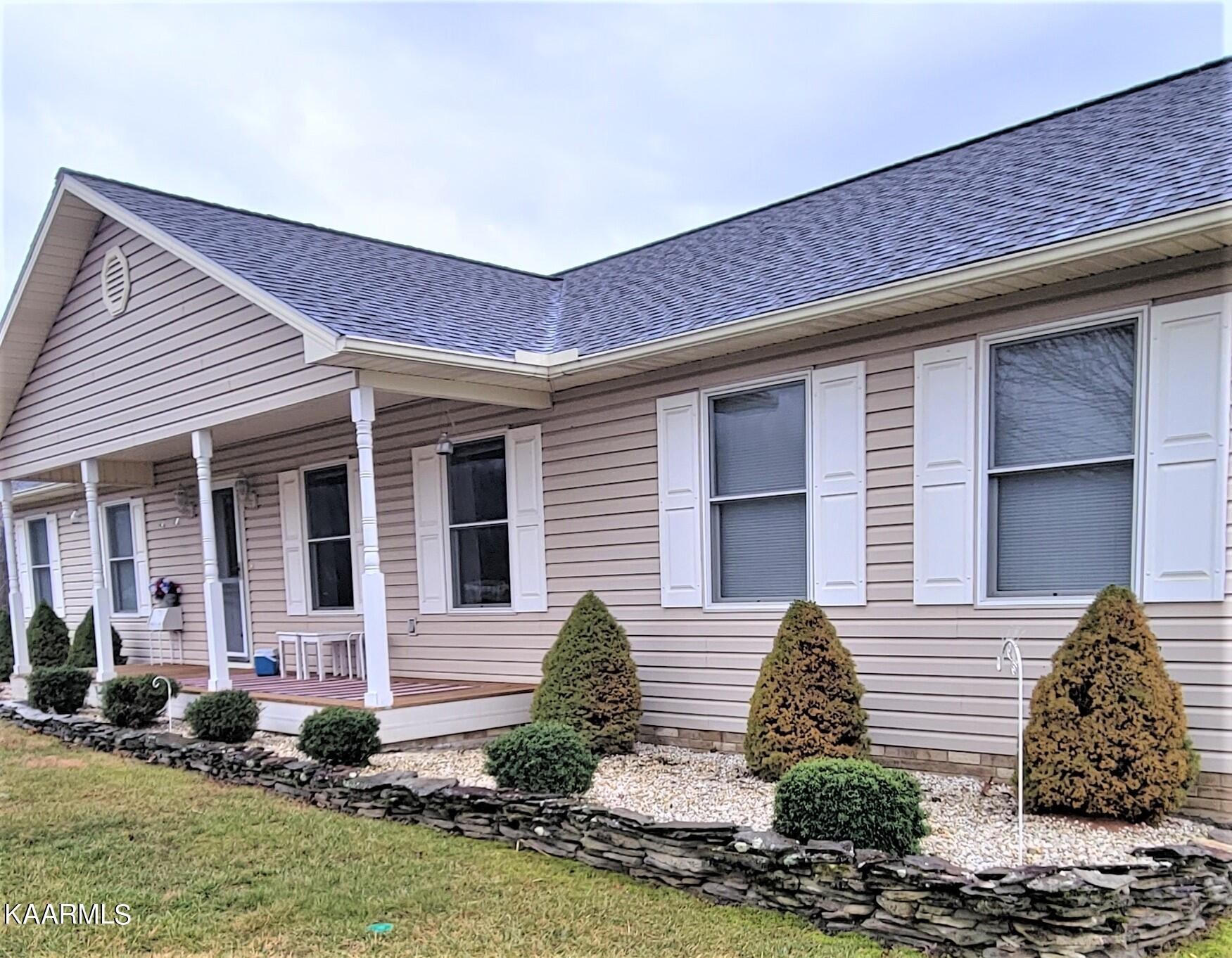 104 Amaryllis Road Newport, TN 37821 - Photo 3 of 37 a front view of a house with garden