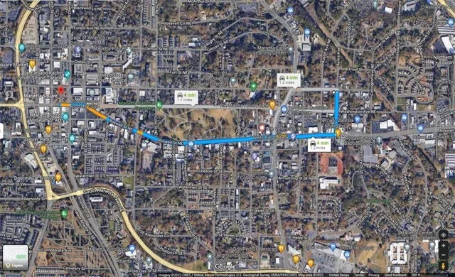 a front view of a house with fountain and entryway