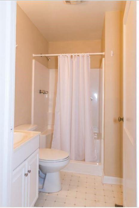 79 Ayers Avenue Marietta, GA 30060 - Photo 9 of 16 a bathroom with a sink a toilet and shower