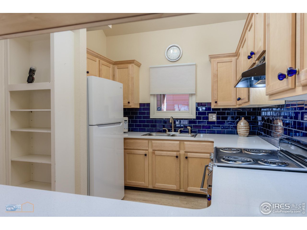 3104 Bell Drive Boulder, CO 80301 - Photo 11 of 40 a kitchen with stainless steel appliances granite countertop a refrigerator and a stove