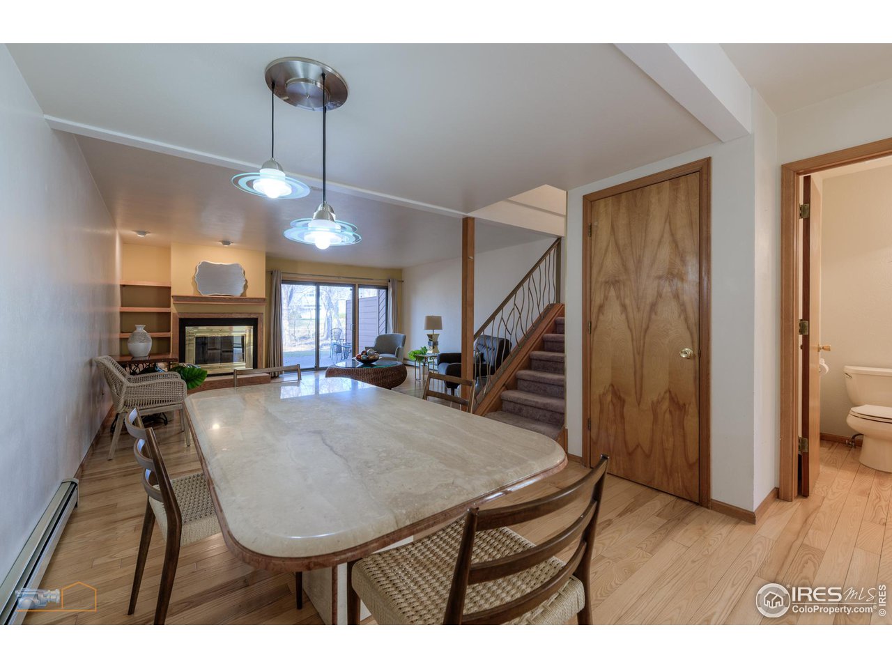 3104 Bell Drive Boulder, CO 80301 - Photo 12 of 40 a view of a livingroom with furniture a fireplace and wooden floor