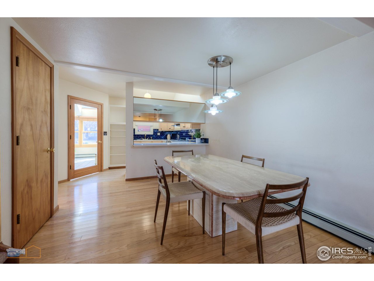3104 Bell Drive Boulder, CO 80301 - Photo 13 of 40 a view of a dining room with furniture and wooden floor