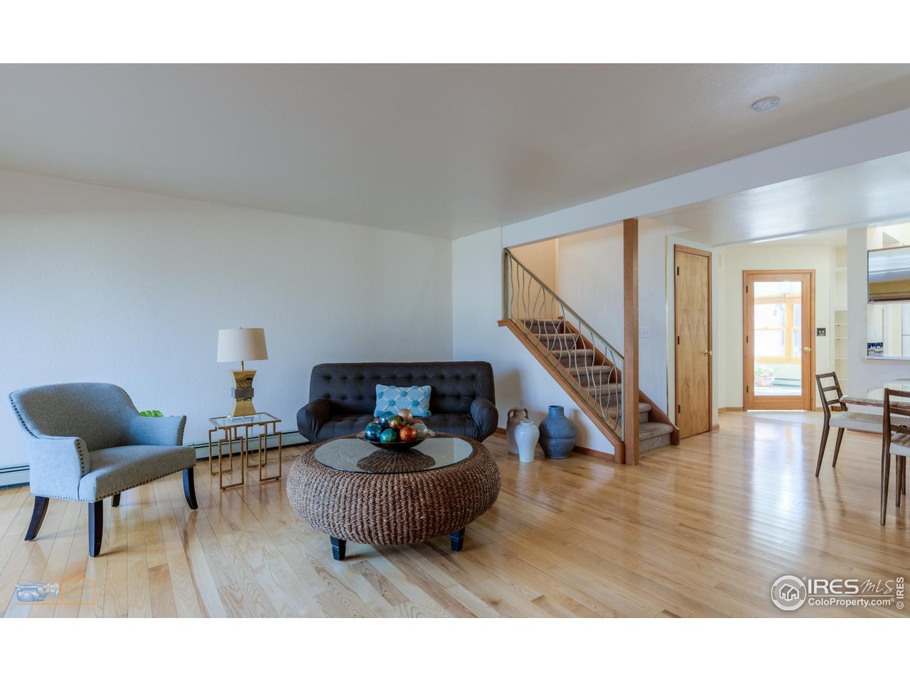 3104 Bell Drive Boulder, CO 80301 - Photo 15 of 40 a living room with furniture and wooden floor