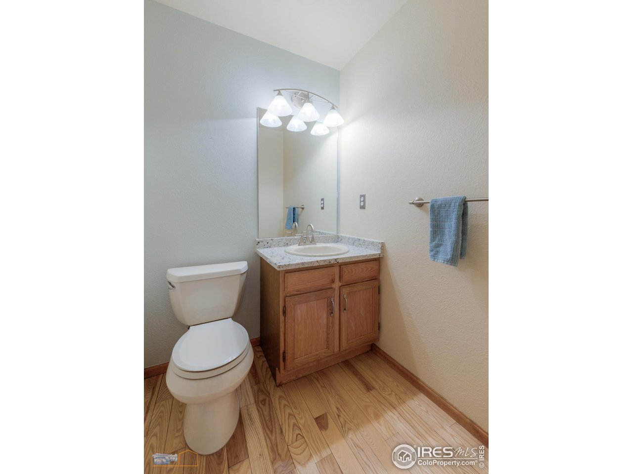 3104 Bell Drive Boulder, CO 80301 - Photo 26 of 40 a bathroom with a toilet sink and mirror