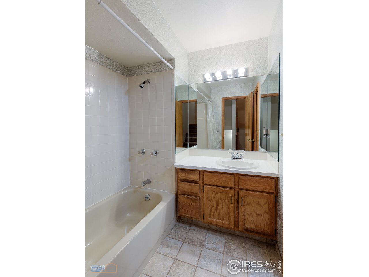 3104 Bell Drive Boulder, CO 80301 - Photo 32 of 40 a bathroom with a tub sink and mirror