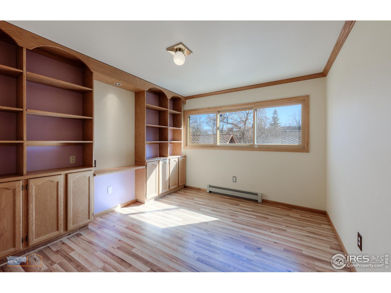 3104 Bell Drive Boulder, CO 80301 - Photo 33 of 40 a view of an empty room with a window and wooden floor