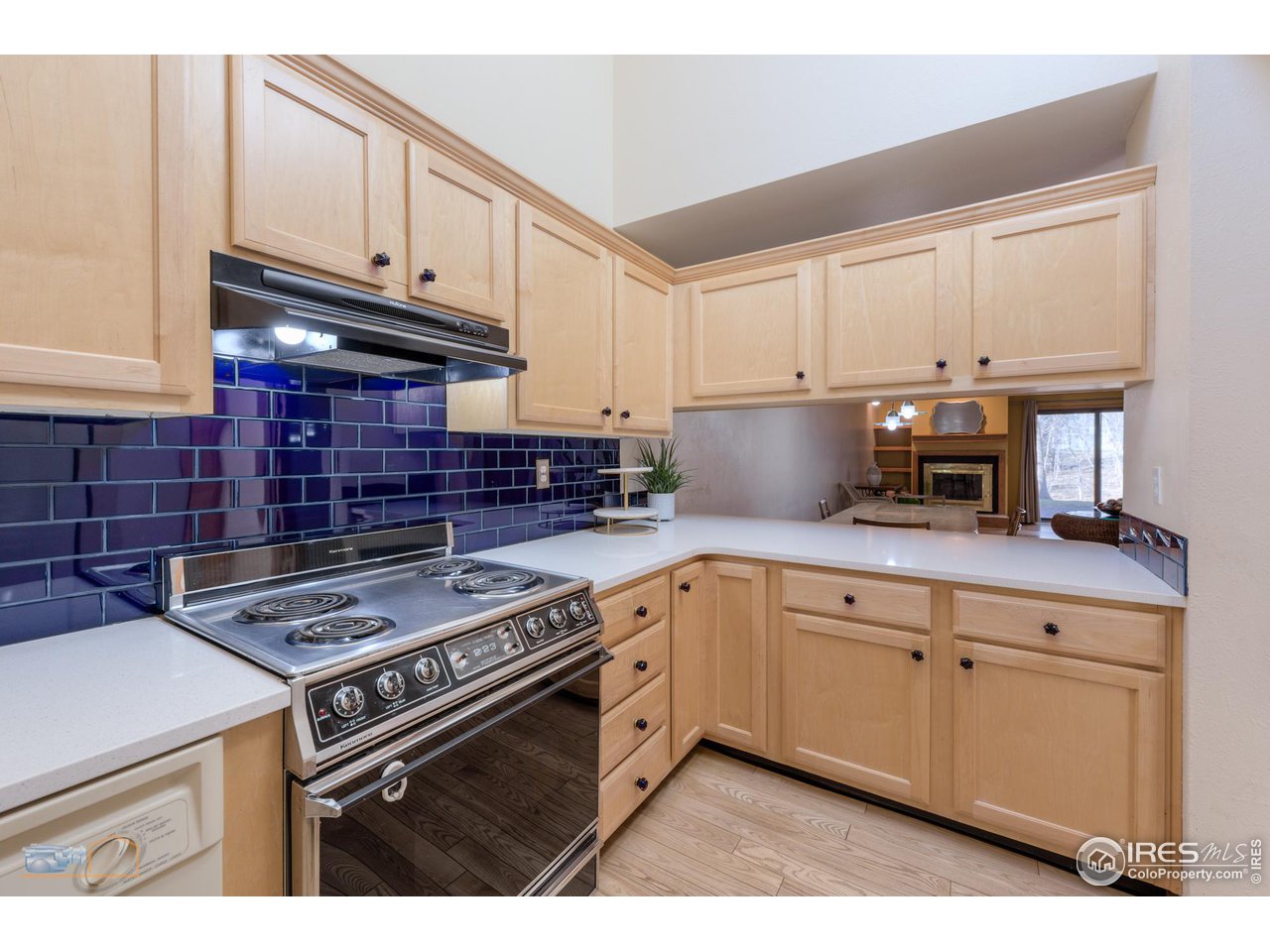 3104 Bell Drive Boulder, CO 80301 - Photo 10 of 40 a kitchen with granite countertop a stove sink and cabinets