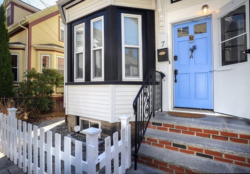 7 Lester Place Boston, MA 02130 - Photo 13 of 33 a front view of a house with a garage