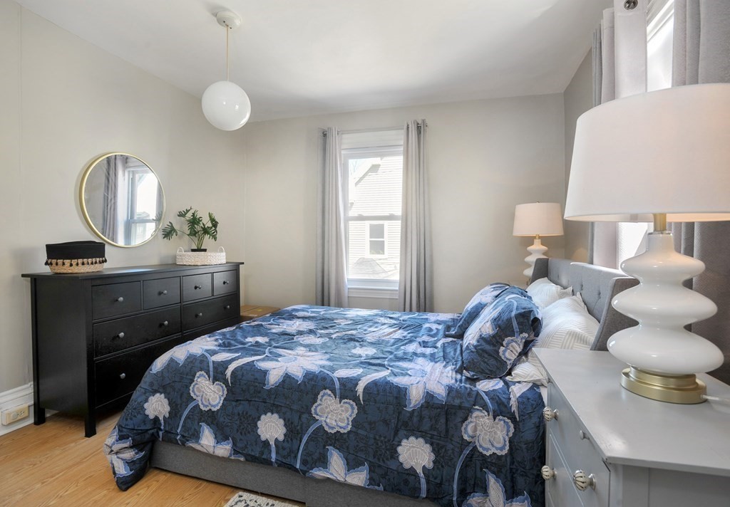 7 Lester Place Boston, MA 02130 - Photo 17 of 33 a bedroom with a bed and a window