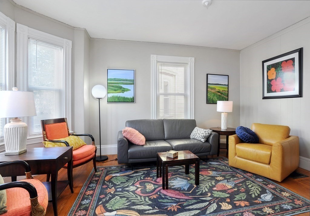 7 Lester Place Boston, MA 02130 - Photo 2 of 33 a living room with furniture and wooden floor