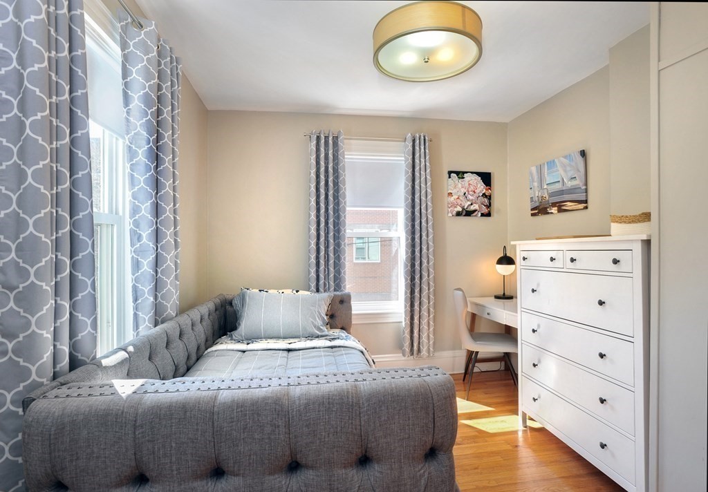 7 Lester Place Boston, MA 02130 - Photo 21 of 33 a bedroom with a bed and furniture