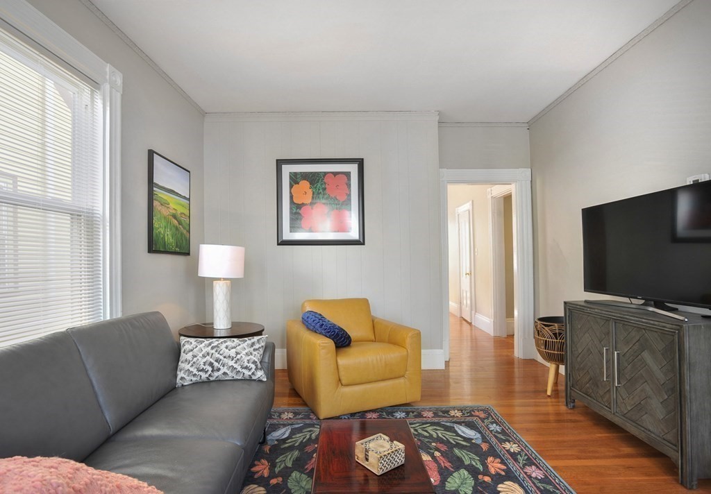 7 Lester Place Boston, MA 02130 - Photo 3 of 33 a living room with furniture and a flat screen tv