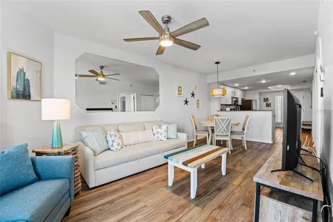 a bedroom with a bed and a flat tv screen on dresser